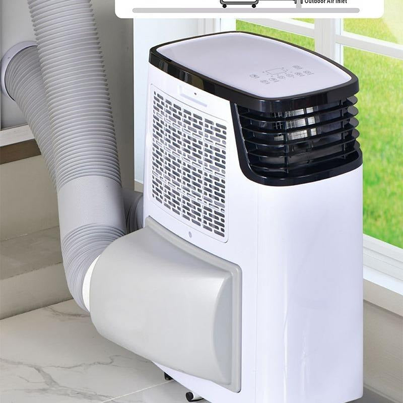 A portable window air conditioner with a white body, black front grille, and a flexible gray exhaust hose, shown installed by a window.