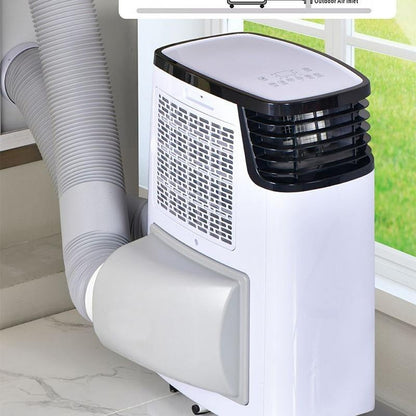 A portable window air conditioner with a white body, black front grille, and a flexible gray exhaust hose, shown installed by a window.